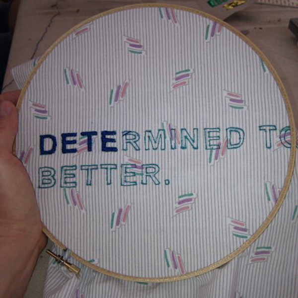 An embroidery circle with the words 